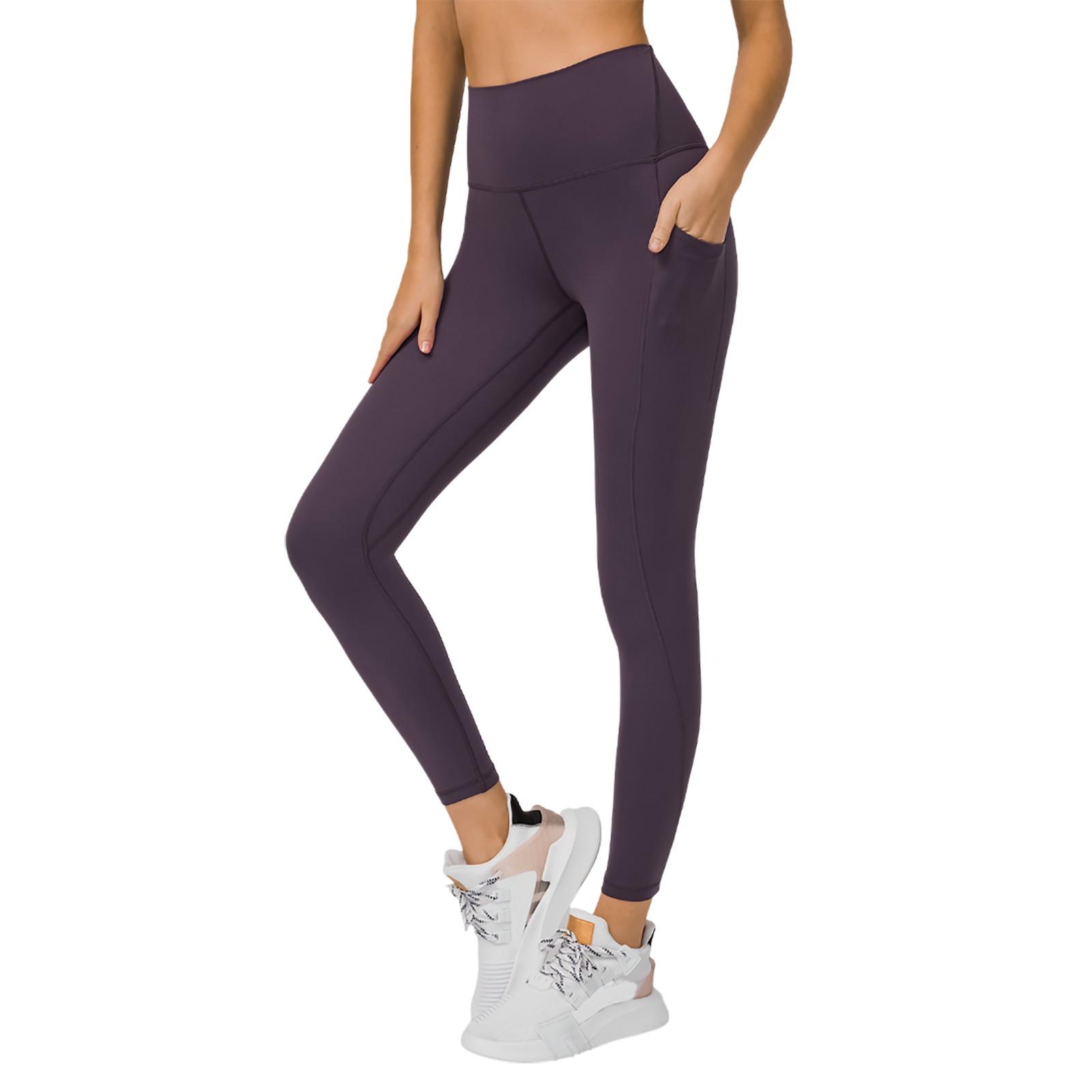 Pantalones de yoga de alto rendimiento con bolsillos laterales: leggings deportivos, nailon y spandex, ajuste ceñido y sujeción.